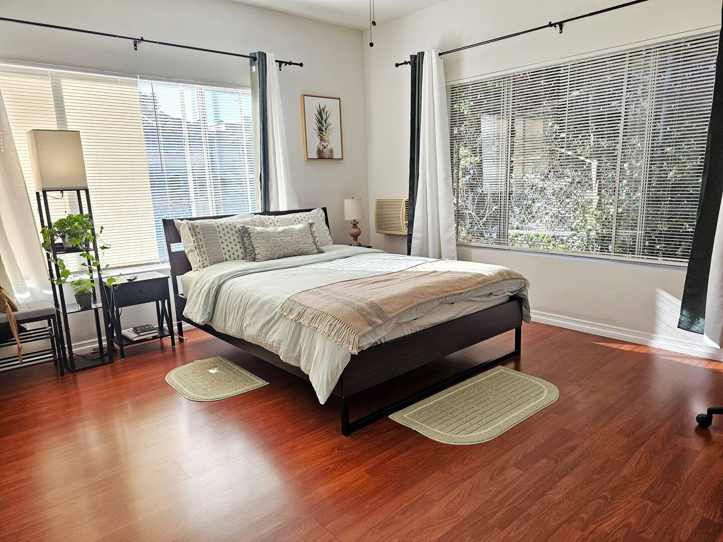 Clean furnished bedroom with natural light